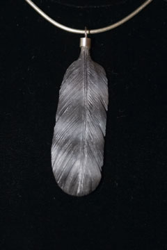 Peregrine falcon feather carving